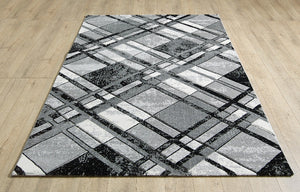 Geometric patterned rug on a wooden floor