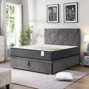 Gray mattress with quilted headboard in a bedroom setting