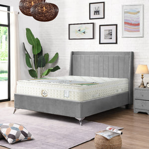 Gray bed frame with white mattress in a bedroom setting.