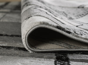 Close-up of a textured gray rug with a pattern