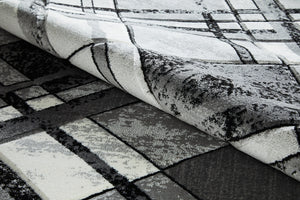 Close-up of a textured black and white fabric with geometric pattern