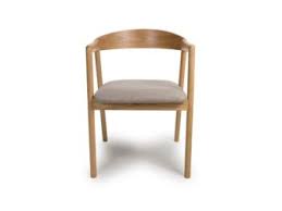 A Anders Oak Dining Chair with a beige upholstered seat and a wooden frame.