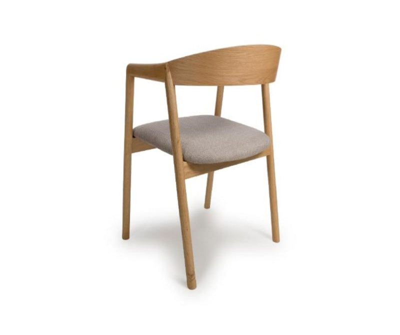 A Anders Oak Dining Chair with a beige upholstered seat and a wooden frame.