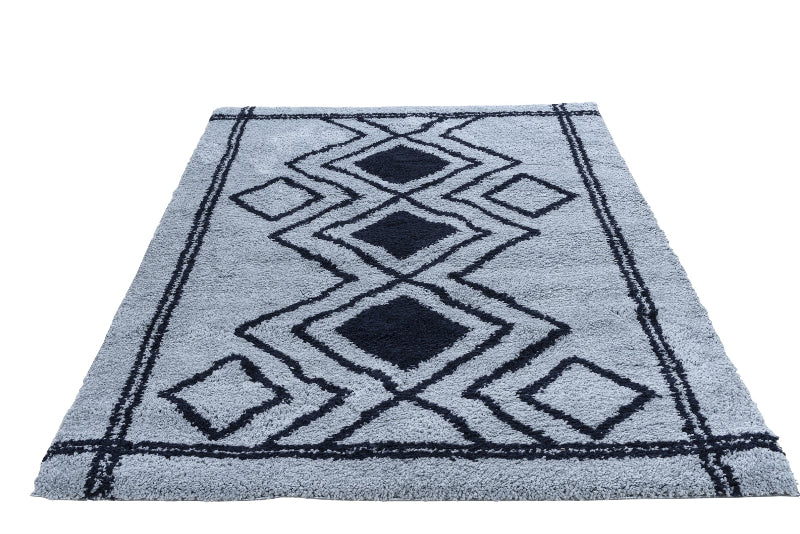 Blue rug with geometric pattern on a white background