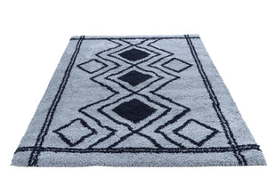 Blue rug with geometric pattern on a white background