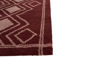 Close-up of a Burgundy rug with geometric pattern on a white background