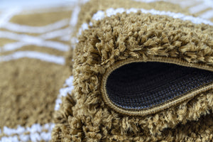 Close-up of a brown textured rug with a visible brand logo.