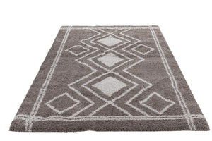 Gray and white geometric patterned rug on a white background
