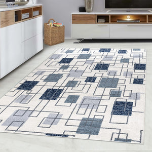 Geometric patterned rug on a light wood floor with white walls and furniture.