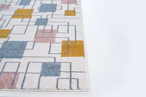 Geometric patterned rug with colorful squares on a white background