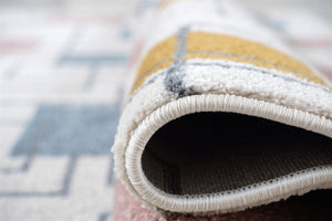 Close-up of a textured rug with a geometric pattern