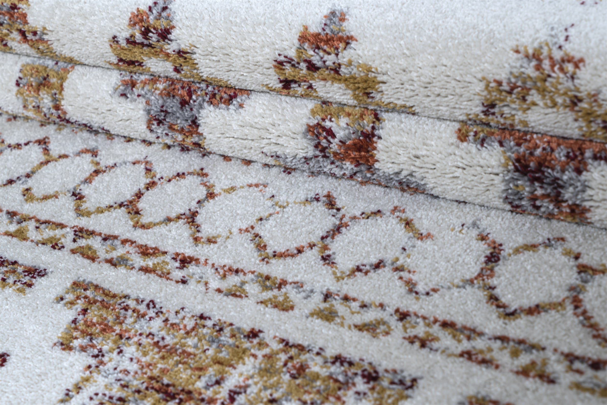 Close-up of a textured fabric with floral pattern