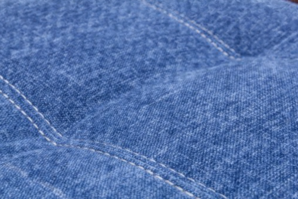 Close-up of blue fabric with stitching details