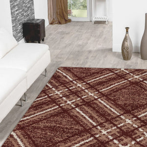 Living room with a brown checkered rug, white sofa, and decorative elements.