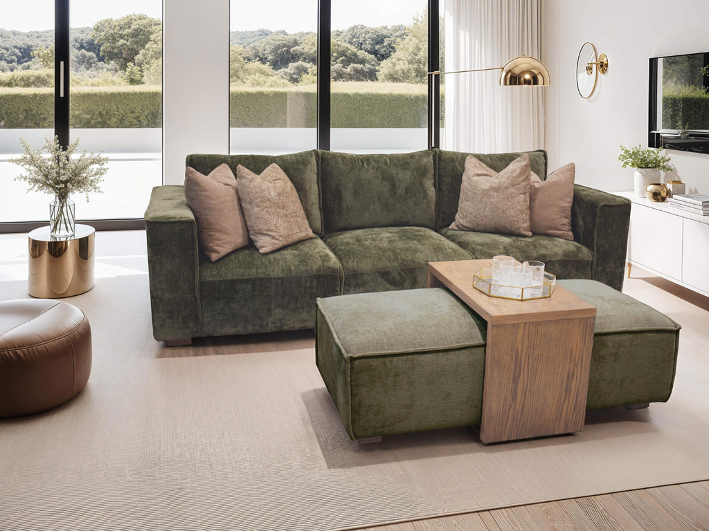 Green sectional sofa with cushions in a modern living room.