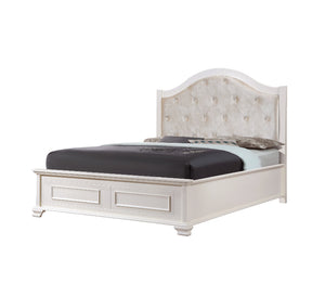 White upholstered bed with tufted headboard on a white background