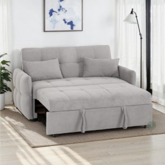 Grey sofa bed in a room with a plant and lamp