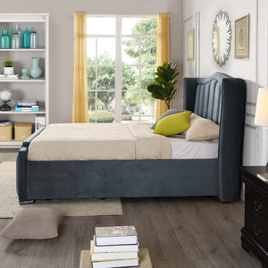 Modern bedroom with a gray upholstered bed, yellow curtains, and decorative items.
