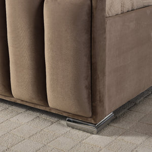 Close-up of a brown sofa corner on a textured floor