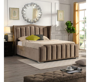 Brown upholstered bed in a stylish bedroom with decorative elements.