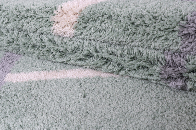Close-up of a textured green fabric with a pattern