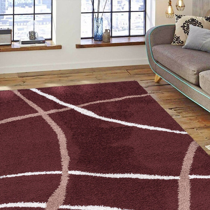 Maroon rug with white lines in a living room setting