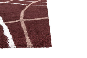 Close-up of a brown and white checkered rug corner on a white background