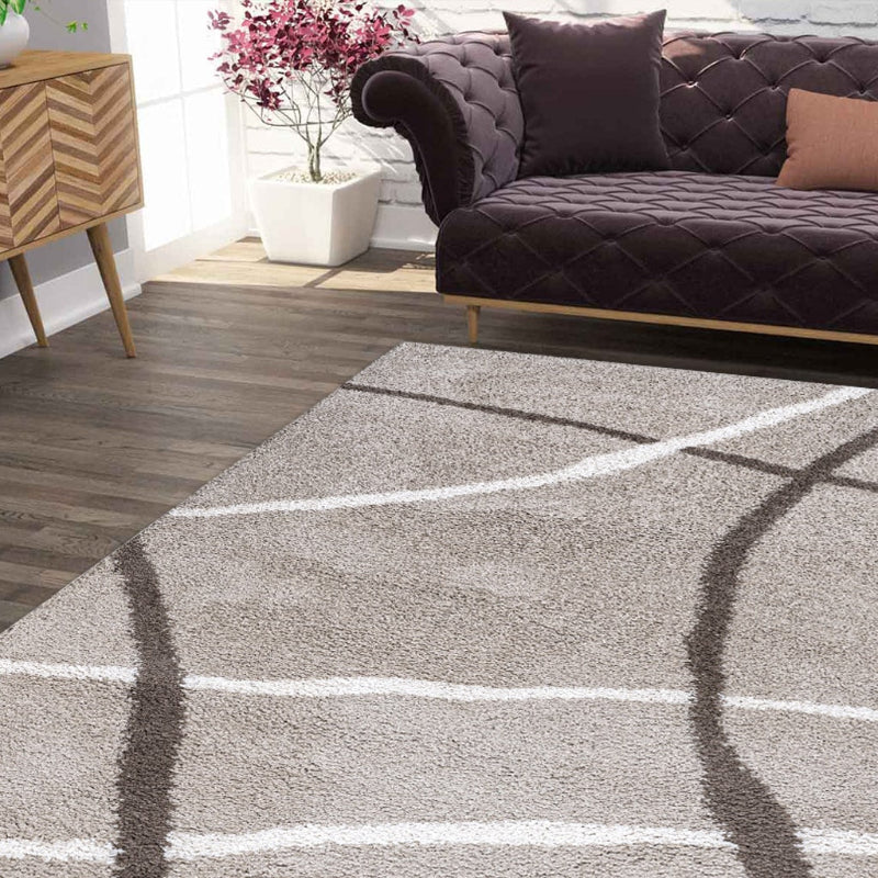 Living room with a gray rug featuring white lines, a dark brown sofa, and decorative items.