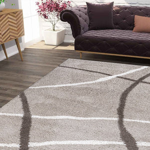 Living room with a gray rug featuring white lines, a dark brown sofa, and decorative items.