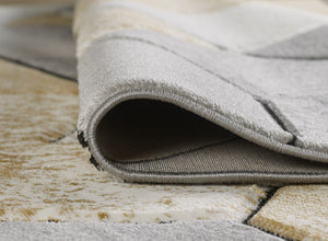 Gray rug on a wooden floor