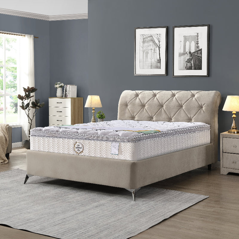 Beige upholstered bed with tufted headboard in a bedroom setting.