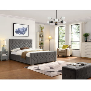 Modern bedroom with grey tufted bed, armchair, and dresser.