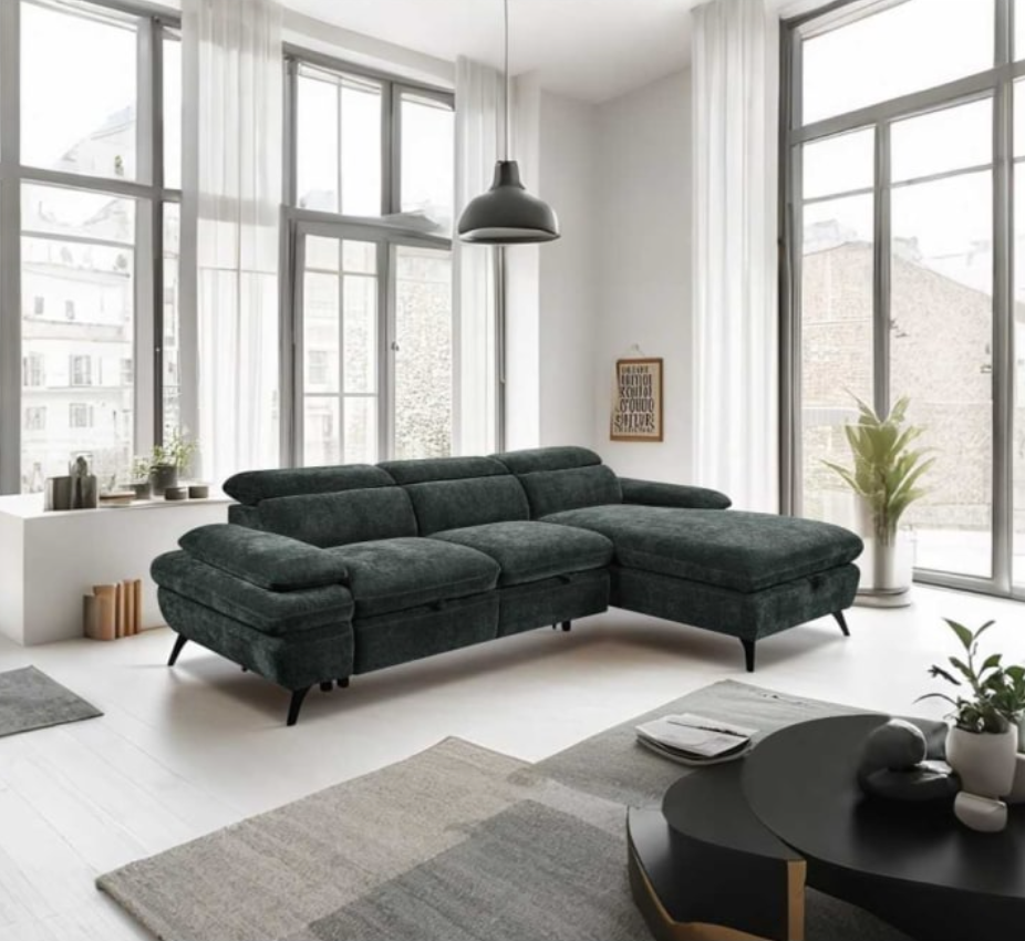 Modern living room with a dark gray sectional sofa, coffee table, and large windows.
