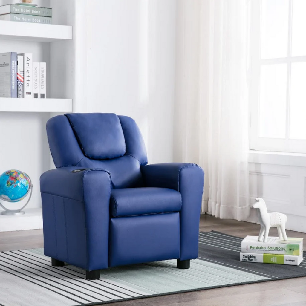 Blue recliner chair in a living room setting with a bookshelf and rug.