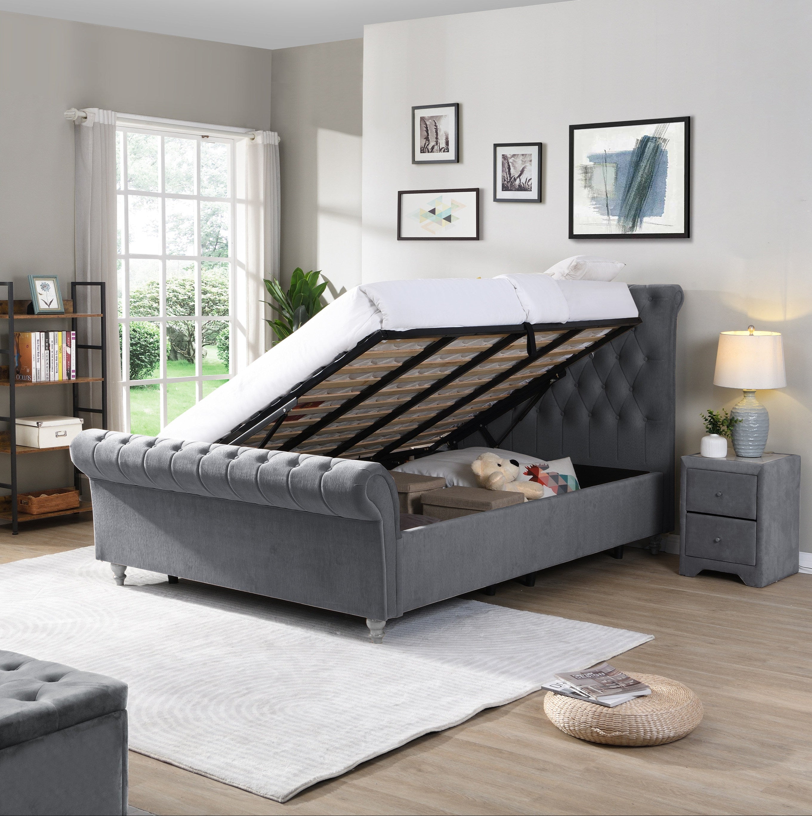 Gray upholstered bed with storage compartments in a bedroom setting.