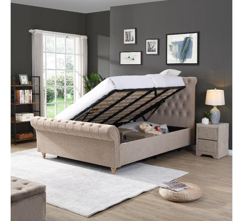 Beige upholstered bed with adjustable base in a bedroom setting.