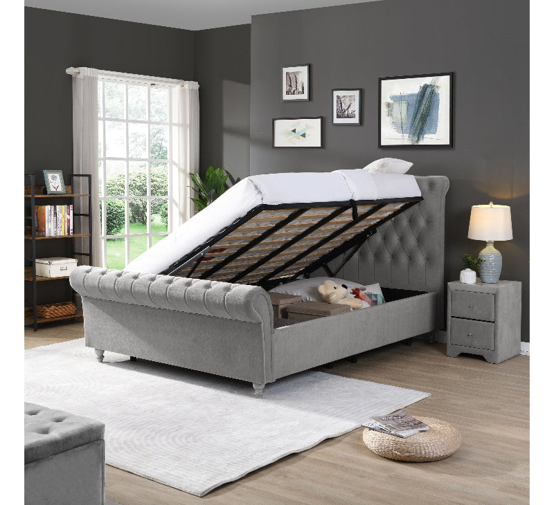 Grey upholstered bed with open storage compartment in a bedroom setting.