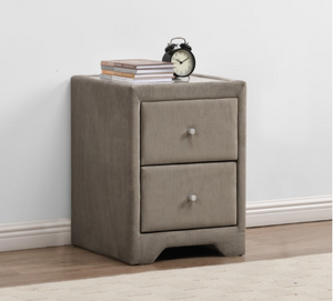 Gray nightstand with two drawers, books, and an alarm clock on a light wood floor.