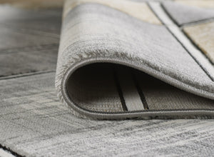 Gray textured rug on a wooden floor