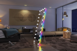 Modern living room with a decorative rainbow light stand.