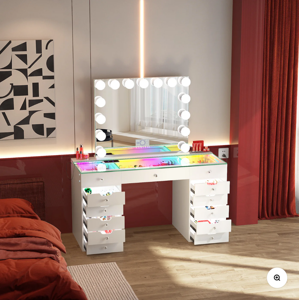 Dressing table with mirror and lights in a bedroom setting