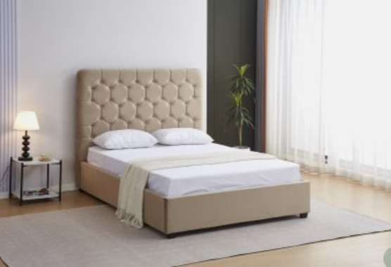 Beige upholstered bed with white bedding in a modern bedroom setting.