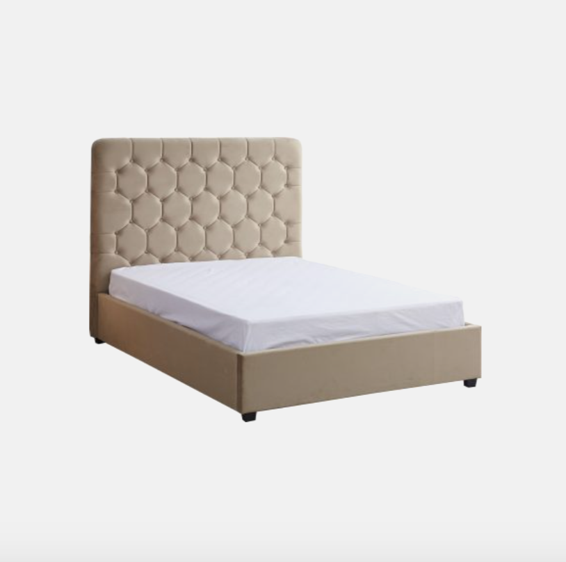 Beige upholstered bed with white mattress on a white background