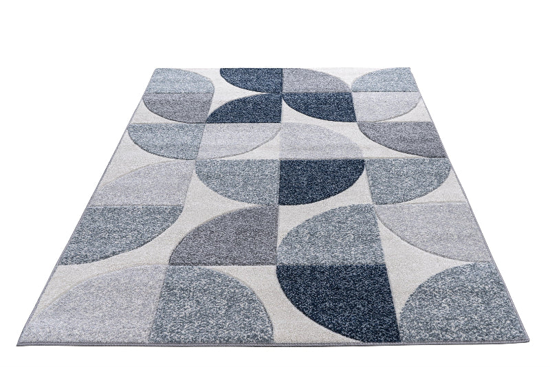 Gray and blue patterned rug on a white background