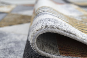 Close-up of a textured rug with a patterned edge