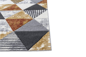 Geometric patterned rug with triangles and squares on a white background
