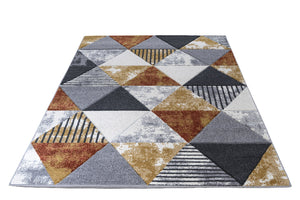 Geometric patterned rug with triangles and stripes on a white background