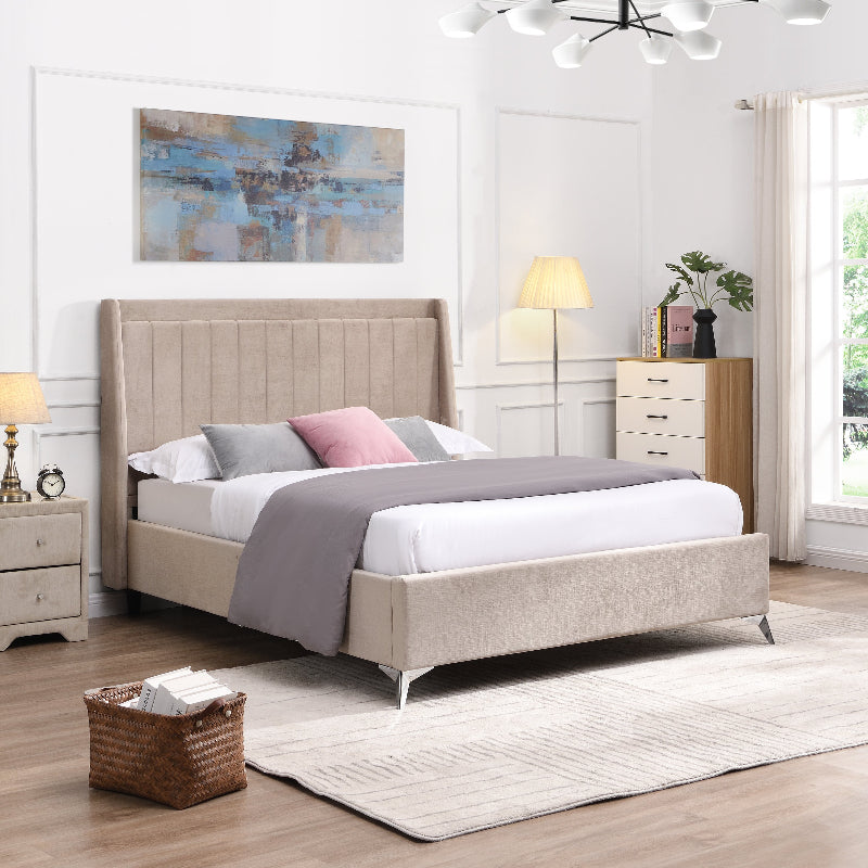 Neatly made bed with beige headboard in a well-lit bedroom.