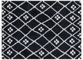 Black and white geometric patterned rug