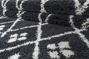 Close-up of a textured black and white patterned rug